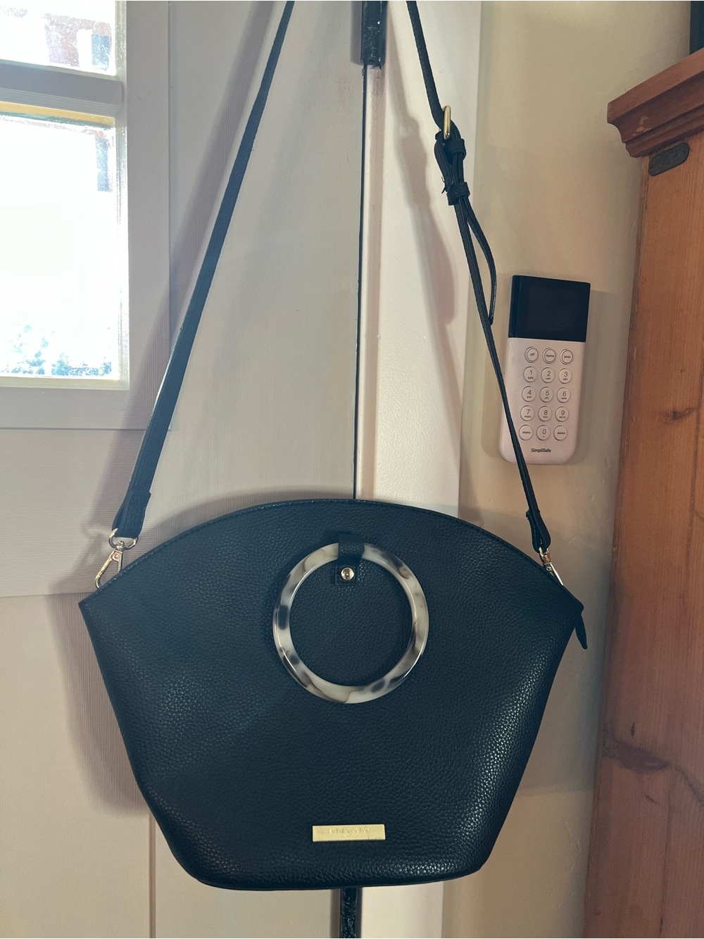 Elegant Katie Loxton Black Crossbody Bag with Tortoiseshell Ring Accent